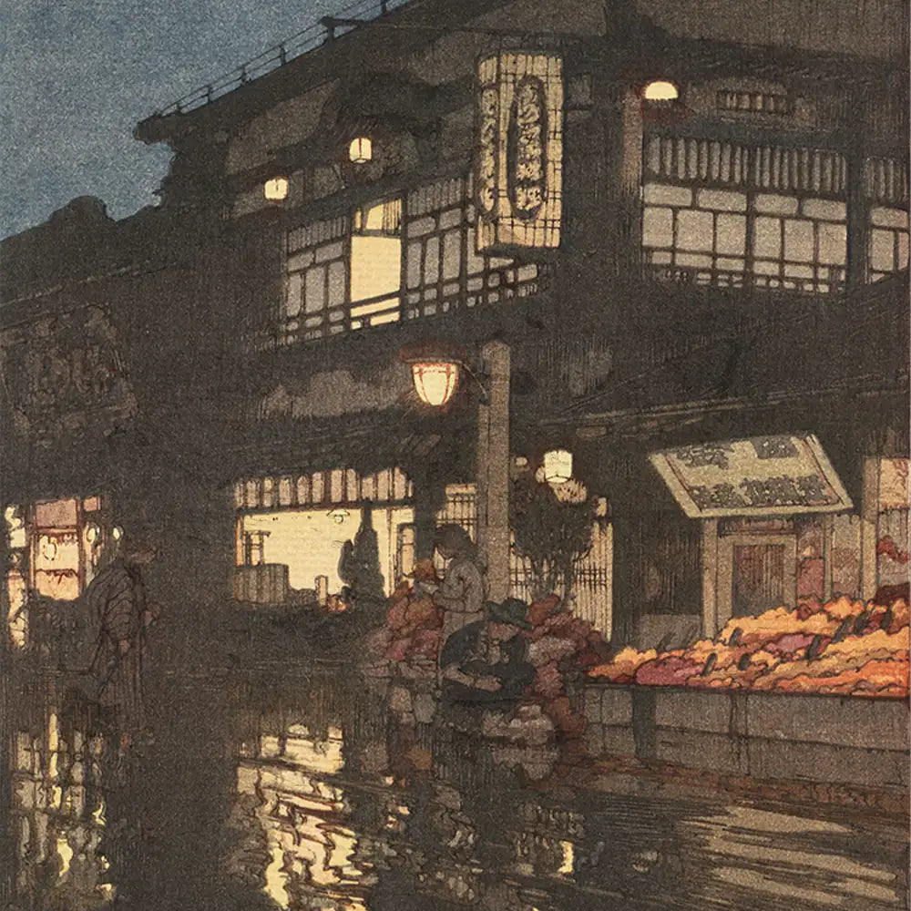 Nighttime scene of a traditional street market with illuminated shops and reflections in wet pavement.