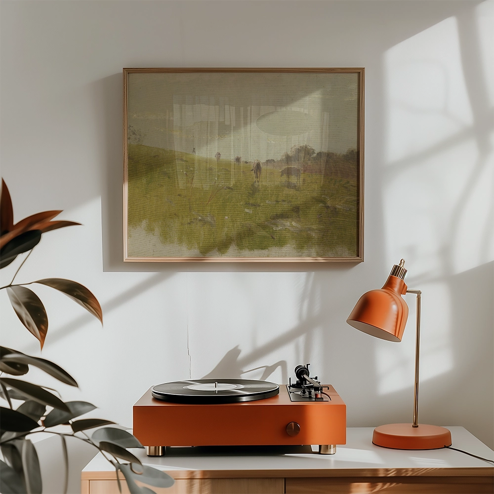 A serene landscape painting in a wooden frame, displayed above a modern orange turntable and lamp in a bright, minimalistic room.