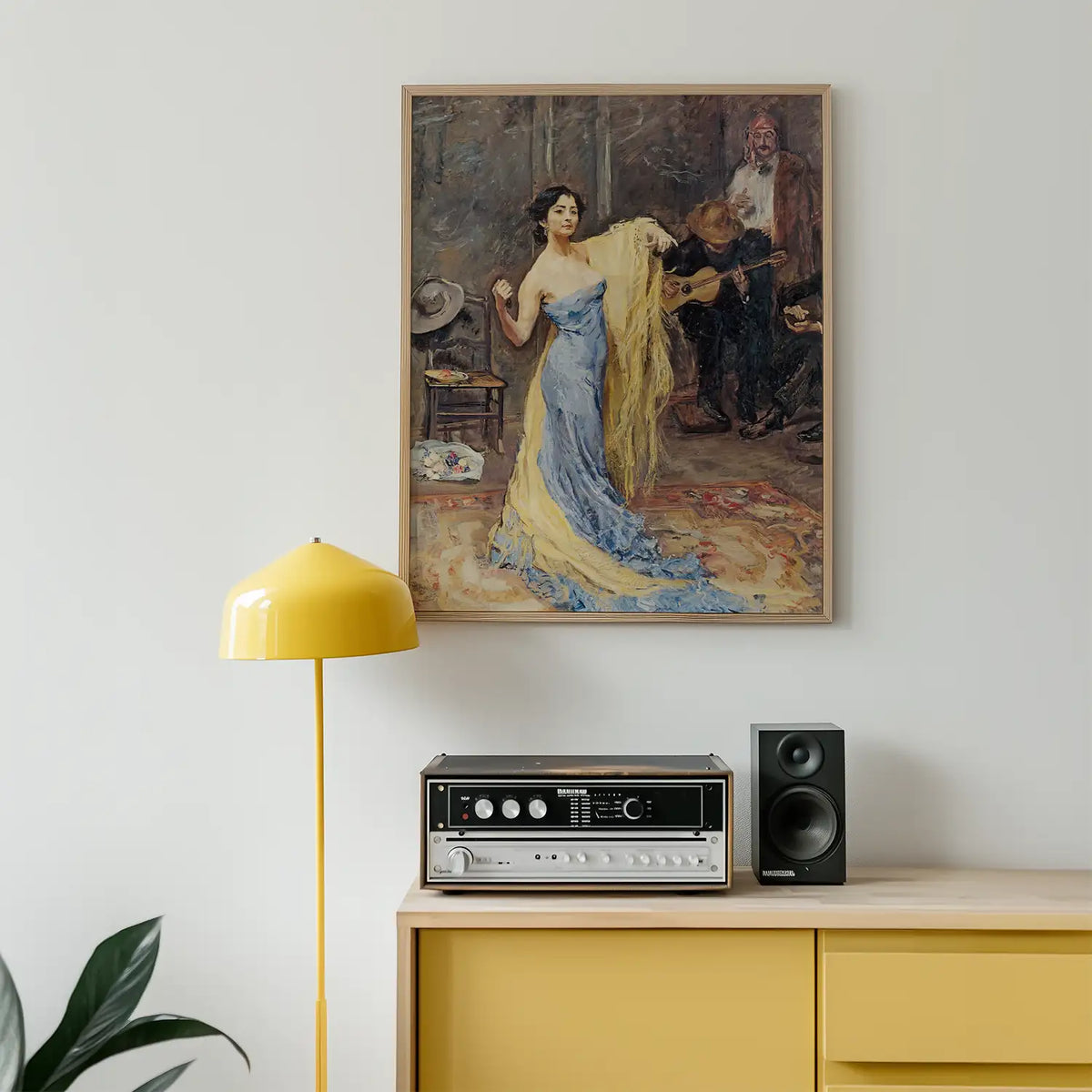 Painting of a woman in a blue gown with yellow drapery, displayed on a wall above a retro record player and speakers, next to a yellow floor lamp in a modern interior setting.
