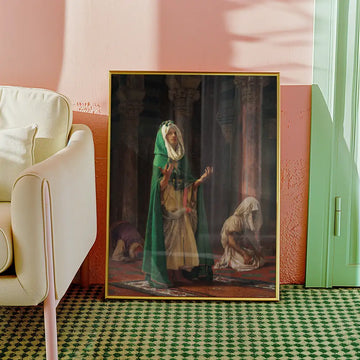 Religious painting featuring a woman in a green cloak praying, with two figures in the background kneeling, displayed in a stylish interior setting.