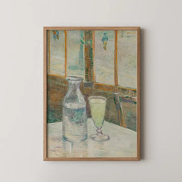 Painting of a glass pitcher and a glass on a table with a blurred background of windows and figures, framed in wood.