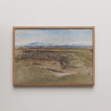Framed watercolor painting of a landscape featuring rolling hills, a river, and distant mountains under a blue sky.