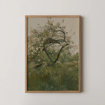 Framed painting of a flowering tree in a green field with soft colors.