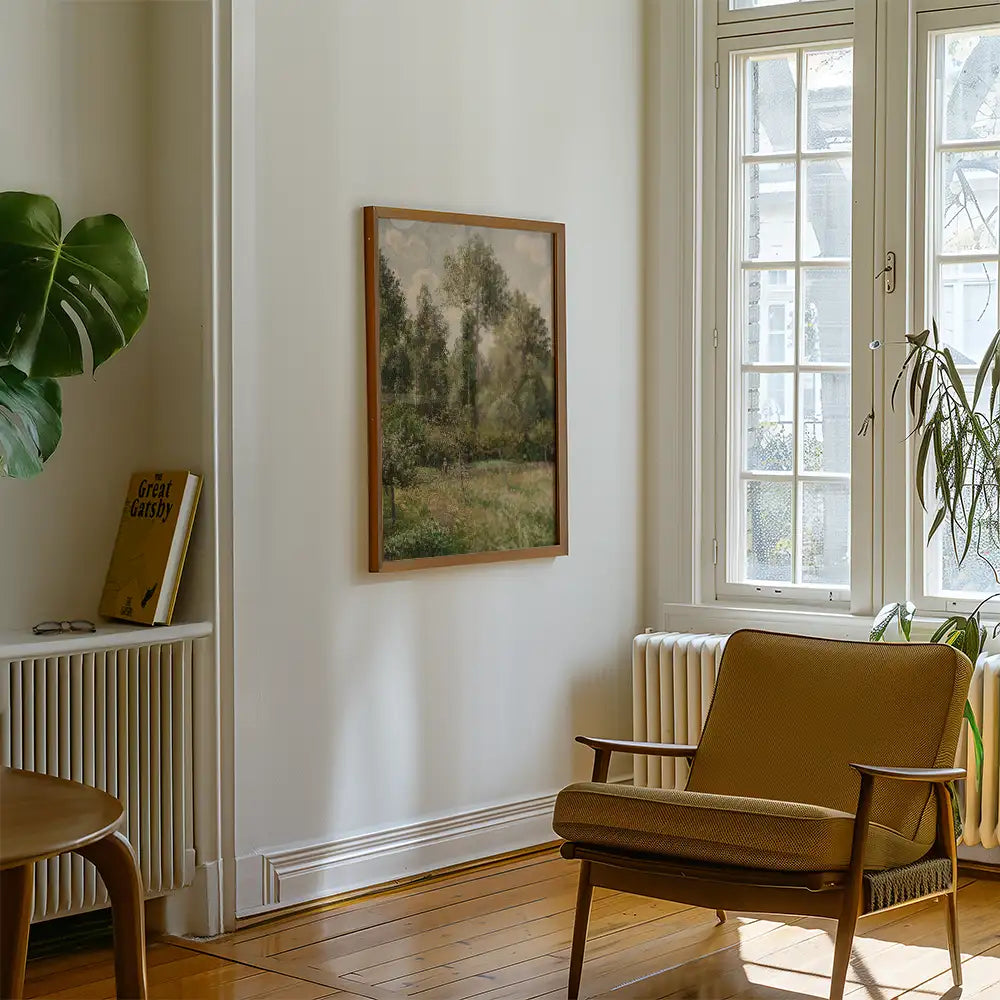 Painting of a serene landscape with trees and grass, framed and hanging on a wall in a cozy living room setting.